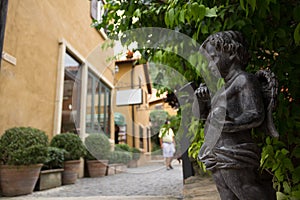 A bronze statue kid angle in italian style