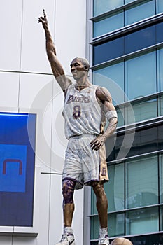 A bronze statue of the LA Lakers basketball player Kobe Bryant in front of Crypto.com Arena in Los Angeles California