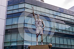 A bronze statue of the LA Lakers basketball player Kobe Bryant in front of Crypto.com Arena in Los Angeles California