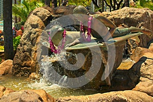 Bronze statue of Makua and Kila at Kuhio Beach Park, Waikiki