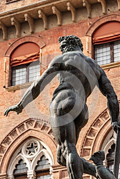 Statue of the god Neptune and Accursio Palace - Bologna Italy photo