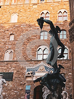 Bronze statue of Perseus holding the head of Medusa in Florence, made by Benvenuto Cellini in 1545