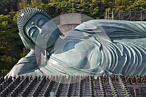 The bronze statue of reclining Buddha state at Nanzoin Temple in Sasaguri, Fukuoka, Japan.This is the bigest lying statue in the