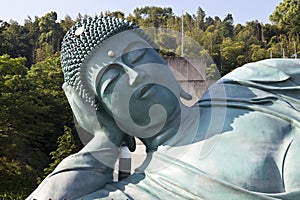 The bronze statue of reclining Buddha state at Nanzoin Temple in Sasaguri, Fukuoka, Japan.This is the bigest lying statue in the