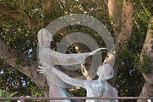 Bronze statue standing in the courtyard of the Church of the Primacy of St. Peter, located on the shores of the Sea of Galilee in