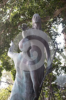 Bronze statue standing in the courtyard of the Church of the Primacy of St. Peter, located on the shores of the Sea of Galilee in