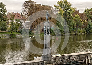 Bronze statues of naked women on a stone column, Vlatava River near Lesser Town side Legion Bridge, Prague
