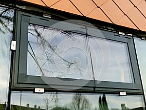 bronze tiles lining the walls of the house, squares similar to