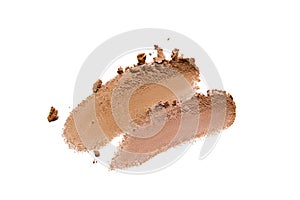 Bronzer, eye shadow swatch smear smudge isolated on white background. Brown makeup powder texture photo