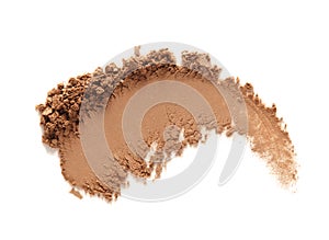 Bronzer or eye shadow swatch smear smudge isolated on white. Brown makeup face powder photo