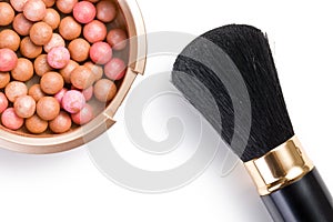 Bronzing pearls and makeup brush