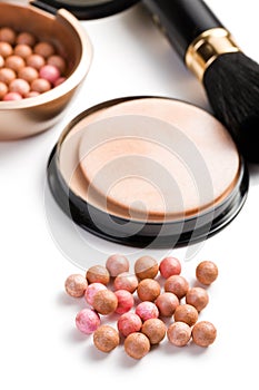 Bronzing pearls and makeup brush