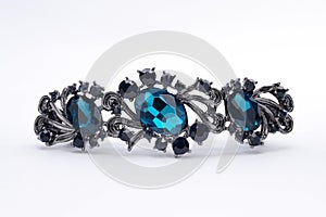 Brooch with blue stones isolated on white