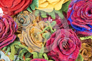 Brooch of fulled wool in the form of flowers