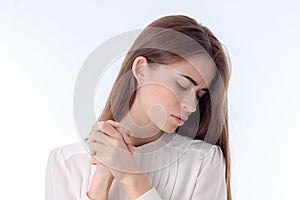 Brooding young girl looking down isolated on white background