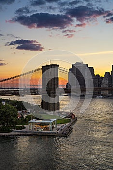 Brooklyn Bridge, Carousel and Financial District at sunset, New York City