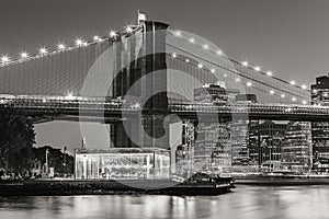 Brooklyn Bridge and carousel at twilight. New York City