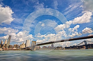 Brooklyn bridge, Hudson river and the island of Manhattan, New York skyline USA