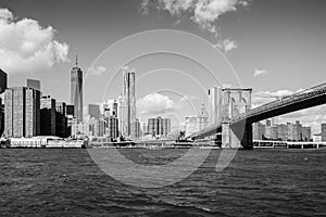 Brooklyn bridge leading to the center of Manhattan New York black white