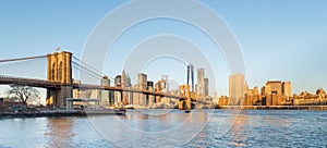 Brooklyn Bridge and Lower Manhattan with Freedom Tower in Morning Light.