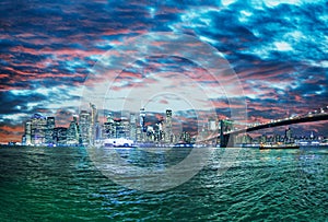 Brooklyn Bridge and Lower Manhattan skylin at sunset