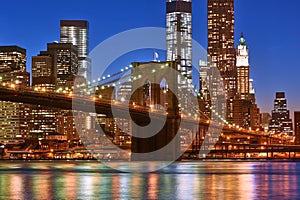 Brooklyn Bridge with lower Manhattan skyline at night