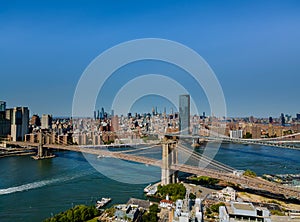 Brooklyn Bridge and Manhattan Bridge with Manhattan New York City skyscrapers city skyline over Hudson River