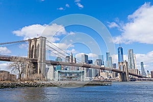 Brooklyn Bridge with Manhattan downtown and Cityscape on sunny day with clear blue sky New York USA