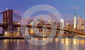 Brooklyn Bridge and Manhattan skyscrapers at sunrise, New York