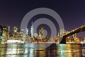 Brooklyn bridge and manhattan waterfront at night