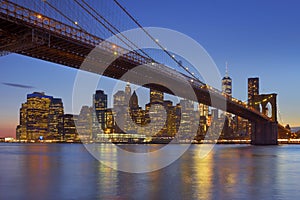 Brooklyn Bridge and New York City skyline at dusk