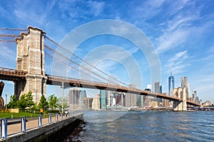 Brooklyn Bridge in New York City skyline of Manhattan with World Trade Center skyscraper in the United States