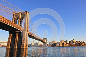 Brooklyn Bridge over East River with view of New York City Lower Manhattan, USA