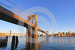 Brooklyn Bridge over East River with view of New York City Lower Manhattan, USA