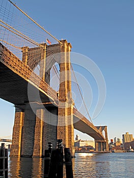 Brooklyn Bridge over East River with view of New York City Lower Manhattan, USA