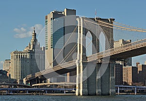 brooklyn bridge view over hudson river with nyc skyline background (urban cityscape of manhattan)