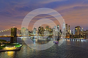 Brooklyn Bridge and Lower Manhattan skyline at night, New York city, USA.