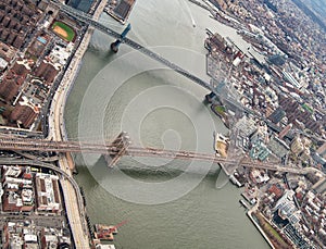 Brooklyn and Manhattan Bridges aerial view from helicopter, New York City. City skyline from a high vantage point - NY - USA