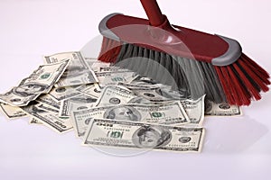 Broom clean dollars on floor.