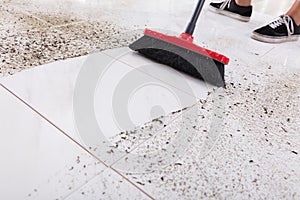 Broom Cleaning Dirt On Tiled Floor