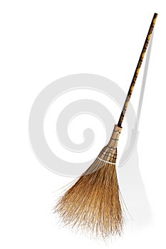 Broom and coconut palms grass for recycle bin and cleansing day, Broom, Witches isolated on background white. witch`s broomstick, photo