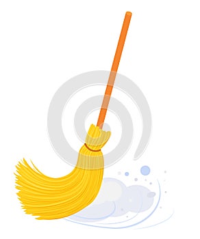 Broom with long wooden handle sweeping floor