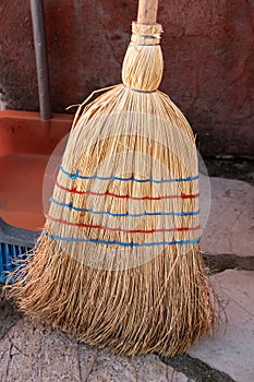 Broom. Old used corn straw broom. Professional natural organic large heavy duty broom. Cleaning tool for home, garden