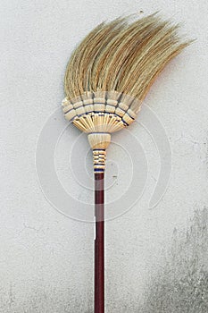 Broom stick on brick wall