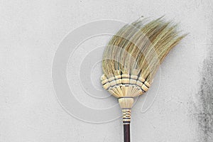 Broom stick on brick wall