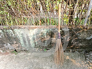 broom sticks from old coconut leaf bones with handmade bamboo stalks are still in demand todaybroom stick