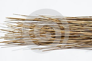 Broom sticks on a white background