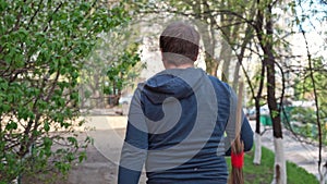 Broom strikes man strolling leisurely along street