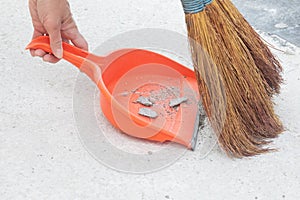 A broom sweeps debris on the floor