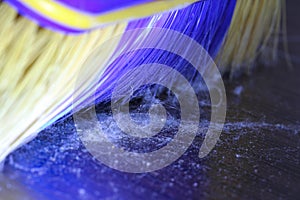 Broom sweeps the dust macro